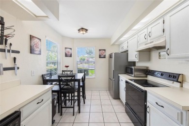 Experience breathtaking lake views from this adorable 3 bedroom on Mayfair Country Club in Florida - for sale on GolfHomes.com, golf home, golf lot