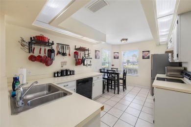 Experience breathtaking lake views from this adorable 3 bedroom on Mayfair Country Club in Florida - for sale on GolfHomes.com, golf home, golf lot