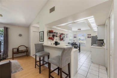Experience breathtaking lake views from this adorable 3 bedroom on Mayfair Country Club in Florida - for sale on GolfHomes.com, golf home, golf lot