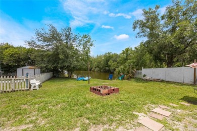Experience breathtaking lake views from this adorable 3 bedroom on Mayfair Country Club in Florida - for sale on GolfHomes.com, golf home, golf lot