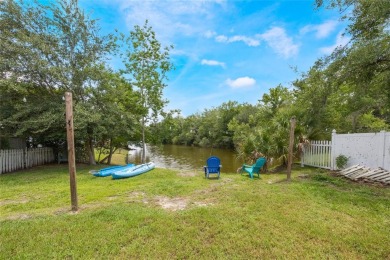 Experience breathtaking lake views from this adorable 3 bedroom on Mayfair Country Club in Florida - for sale on GolfHomes.com, golf home, golf lot