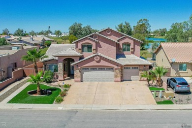 Welcome to your dream home! This spacious 2,451 sq. ft on Cocopah Rio Colorado Golf Course in Arizona - for sale on GolfHomes.com, golf home, golf lot