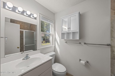 Tucked among the trees in the waterfront community of Fairfield on Harbour Point Golf Club in North Carolina - for sale on GolfHomes.com, golf home, golf lot