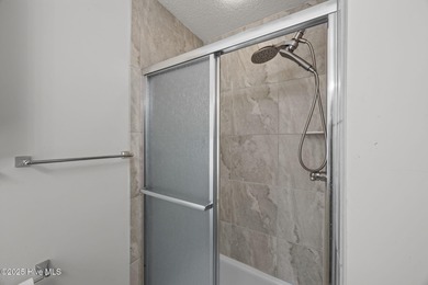 Tucked among the trees in the waterfront community of Fairfield on Harbour Point Golf Club in North Carolina - for sale on GolfHomes.com, golf home, golf lot