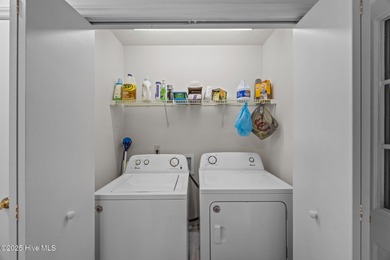 Tucked among the trees in the waterfront community of Fairfield on Harbour Point Golf Club in North Carolina - for sale on GolfHomes.com, golf home, golf lot