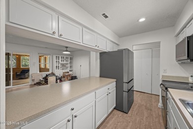 Tucked among the trees in the waterfront community of Fairfield on Harbour Point Golf Club in North Carolina - for sale on GolfHomes.com, golf home, golf lot