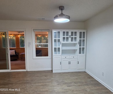 Tucked among the trees in the waterfront community of Fairfield on Harbour Point Golf Club in North Carolina - for sale on GolfHomes.com, golf home, golf lot