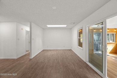 Tucked among the trees in the waterfront community of Fairfield on Harbour Point Golf Club in North Carolina - for sale on GolfHomes.com, golf home, golf lot