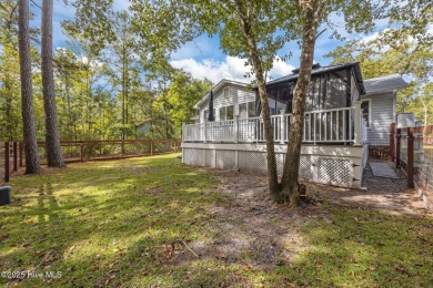 Tucked among the trees in the waterfront community of Fairfield on Harbour Point Golf Club in North Carolina - for sale on GolfHomes.com, golf home, golf lot