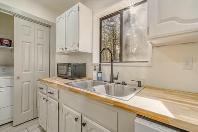 Welcome to 50 Knollwood Way, a quintessential A-frame chalet on Angel Fire Resort Country Club in New Mexico - for sale on GolfHomes.com, golf home, golf lot