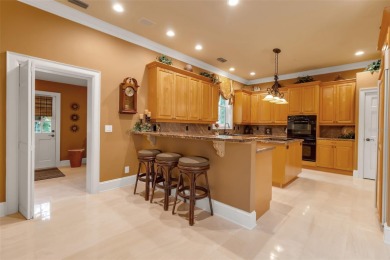 A grand traditional residence, this 3-bedroom, 3.5-bath home is on The Oaks Club in Florida - for sale on GolfHomes.com, golf home, golf lot