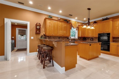 A grand traditional residence, this 3-bedroom, 3.5-bath home is on The Oaks Club in Florida - for sale on GolfHomes.com, golf home, golf lot