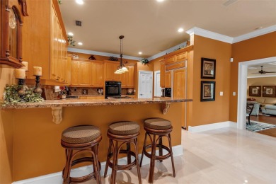 A grand traditional residence, this 3-bedroom, 3.5-bath home is on The Oaks Club in Florida - for sale on GolfHomes.com, golf home, golf lot