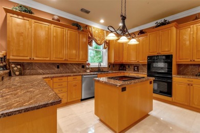 A grand traditional residence, this 3-bedroom, 3.5-bath home is on The Oaks Club in Florida - for sale on GolfHomes.com, golf home, golf lot