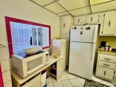 Experience stunning views from this generously sized one-bedroom on Turnberry Isle Resort and Club in Florida - for sale on GolfHomes.com, golf home, golf lot