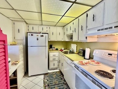 Experience stunning views from this generously sized one-bedroom on Turnberry Isle Resort and Club in Florida - for sale on GolfHomes.com, golf home, golf lot