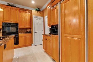 A grand traditional residence, this 3-bedroom, 3.5-bath home is on The Oaks Club in Florida - for sale on GolfHomes.com, golf home, golf lot