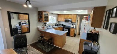 Here's your chance to own a 3 bedroom, 1.5 bathroom, brick ranch on Silver Lake Golf Club in Michigan - for sale on GolfHomes.com, golf home, golf lot