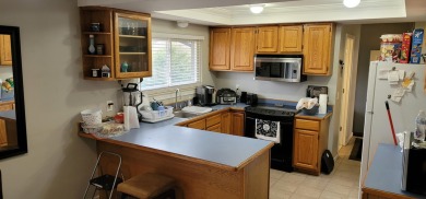 Here's your chance to own a 3 bedroom, 1.5 bathroom, brick ranch on Silver Lake Golf Club in Michigan - for sale on GolfHomes.com, golf home, golf lot