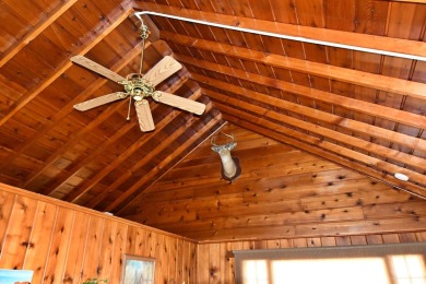 Step into rustic charm with this almost all-knotty pine interior on Birch Pointe Golf Club in Michigan - for sale on GolfHomes.com, golf home, golf lot