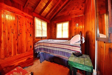 Step into rustic charm with this almost all-knotty pine interior on Birch Pointe Golf Club in Michigan - for sale on GolfHomes.com, golf home, golf lot