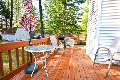 Step into rustic charm with this almost all-knotty pine interior on Birch Pointe Golf Club in Michigan - for sale on GolfHomes.com, golf home, golf lot