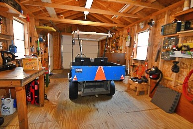 Step into rustic charm with this almost all-knotty pine interior on Birch Pointe Golf Club in Michigan - for sale on GolfHomes.com, golf home, golf lot