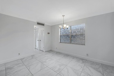 LOVELY UPDATED UNIT WITH WHITE CABINETRY AND STAINLESS STEEL on Kings Point Golf -Flanders Way in Florida - for sale on GolfHomes.com, golf home, golf lot