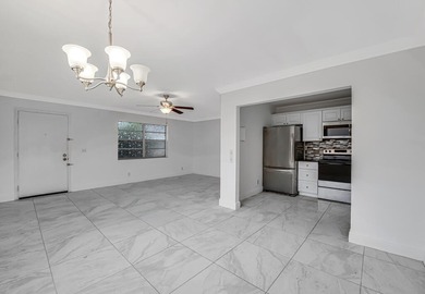 LOVELY UPDATED UNIT WITH WHITE CABINETRY AND STAINLESS STEEL on Kings Point Golf -Flanders Way in Florida - for sale on GolfHomes.com, golf home, golf lot