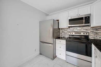 LOVELY UPDATED UNIT WITH WHITE CABINETRY AND STAINLESS STEEL on Kings Point Golf -Flanders Way in Florida - for sale on GolfHomes.com, golf home, golf lot