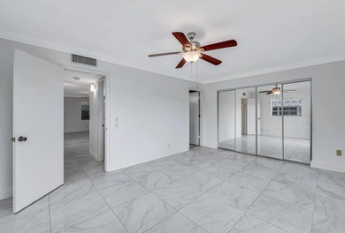 LOVELY UPDATED UNIT WITH WHITE CABINETRY AND STAINLESS STEEL on Kings Point Golf -Flanders Way in Florida - for sale on GolfHomes.com, golf home, golf lot