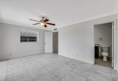 LOVELY UPDATED UNIT WITH WHITE CABINETRY AND STAINLESS STEEL on Kings Point Golf -Flanders Way in Florida - for sale on GolfHomes.com, golf home, golf lot