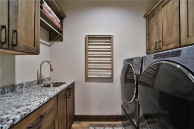 Don't miss this three-bedroom, four-bath custom-built home. Home on Blueberry Pines Golf CLub in Minnesota - for sale on GolfHomes.com, golf home, golf lot
