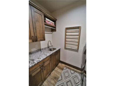 Don't miss this three-bedroom, four-bath custom-built home. Home on Blueberry Pines Golf CLub in Minnesota - for sale on GolfHomes.com, golf home, golf lot