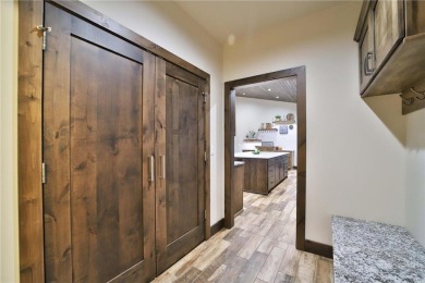 Don't miss this three-bedroom, four-bath custom-built home. Home on Blueberry Pines Golf CLub in Minnesota - for sale on GolfHomes.com, golf home, golf lot