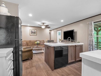 Nestled among the pines, this charming 2-bedroom, 2-bath turnkey on Rayburn Country Club in Texas - for sale on GolfHomes.com, golf home, golf lot