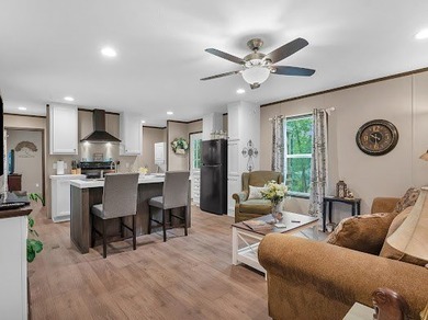 Nestled among the pines, this charming 2-bedroom, 2-bath turnkey on Rayburn Country Club in Texas - for sale on GolfHomes.com, golf home, golf lot