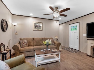 Nestled among the pines, this charming 2-bedroom, 2-bath turnkey on Rayburn Country Club in Texas - for sale on GolfHomes.com, golf home, golf lot
