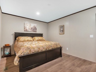 Nestled among the pines, this charming 2-bedroom, 2-bath turnkey on Rayburn Country Club in Texas - for sale on GolfHomes.com, golf home, golf lot