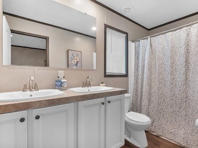 Nestled among the pines, this charming 2-bedroom, 2-bath turnkey on Rayburn Country Club in Texas - for sale on GolfHomes.com, golf home, golf lot