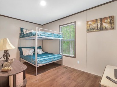 Nestled among the pines, this charming 2-bedroom, 2-bath turnkey on Rayburn Country Club in Texas - for sale on GolfHomes.com, golf home, golf lot