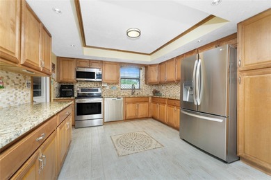 Start your morning with a cup of coffee and end it on the green on Rotonda Golf and Country Club The Hills Course in Florida - for sale on GolfHomes.com, golf home, golf lot