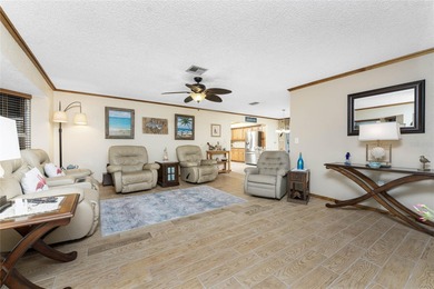 Start your morning with a cup of coffee and end it on the green on Rotonda Golf and Country Club The Hills Course in Florida - for sale on GolfHomes.com, golf home, golf lot