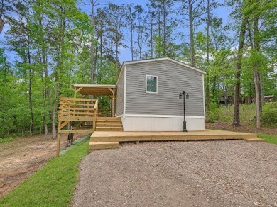 Nestled among the pines, this charming 2-bedroom, 2-bath turnkey on Rayburn Country Club in Texas - for sale on GolfHomes.com, golf home, golf lot