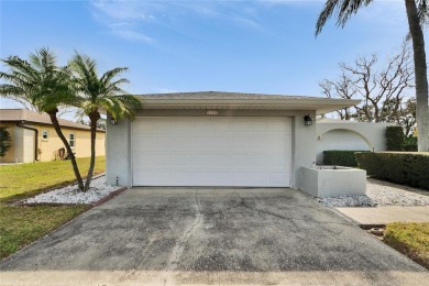 Welcome to this inviting Florida 2-bedroom, 2-bathroom home on Mainlands Golf Club in Florida - for sale on GolfHomes.com, golf home, golf lot