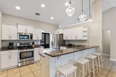 Nestled on an oversized lot, this single-level brick home in on Santa Rosa Golf and Beach Club in Florida - for sale on GolfHomes.com, golf home, golf lot