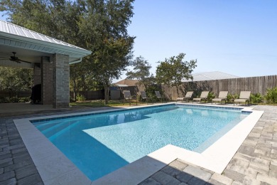 Nestled on an oversized lot, this single-level brick home in on Santa Rosa Golf and Beach Club in Florida - for sale on GolfHomes.com, golf home, golf lot