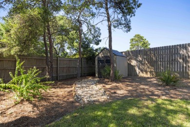 Nestled on an oversized lot, this single-level brick home in on Santa Rosa Golf and Beach Club in Florida - for sale on GolfHomes.com, golf home, golf lot