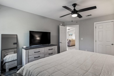 Nestled on an oversized lot, this single-level brick home in on Santa Rosa Golf and Beach Club in Florida - for sale on GolfHomes.com, golf home, golf lot
