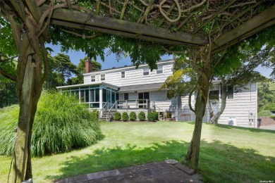 Spacious home with a large living room featuring a wood-burning on National Golf Links of America in New York - for sale on GolfHomes.com, golf home, golf lot